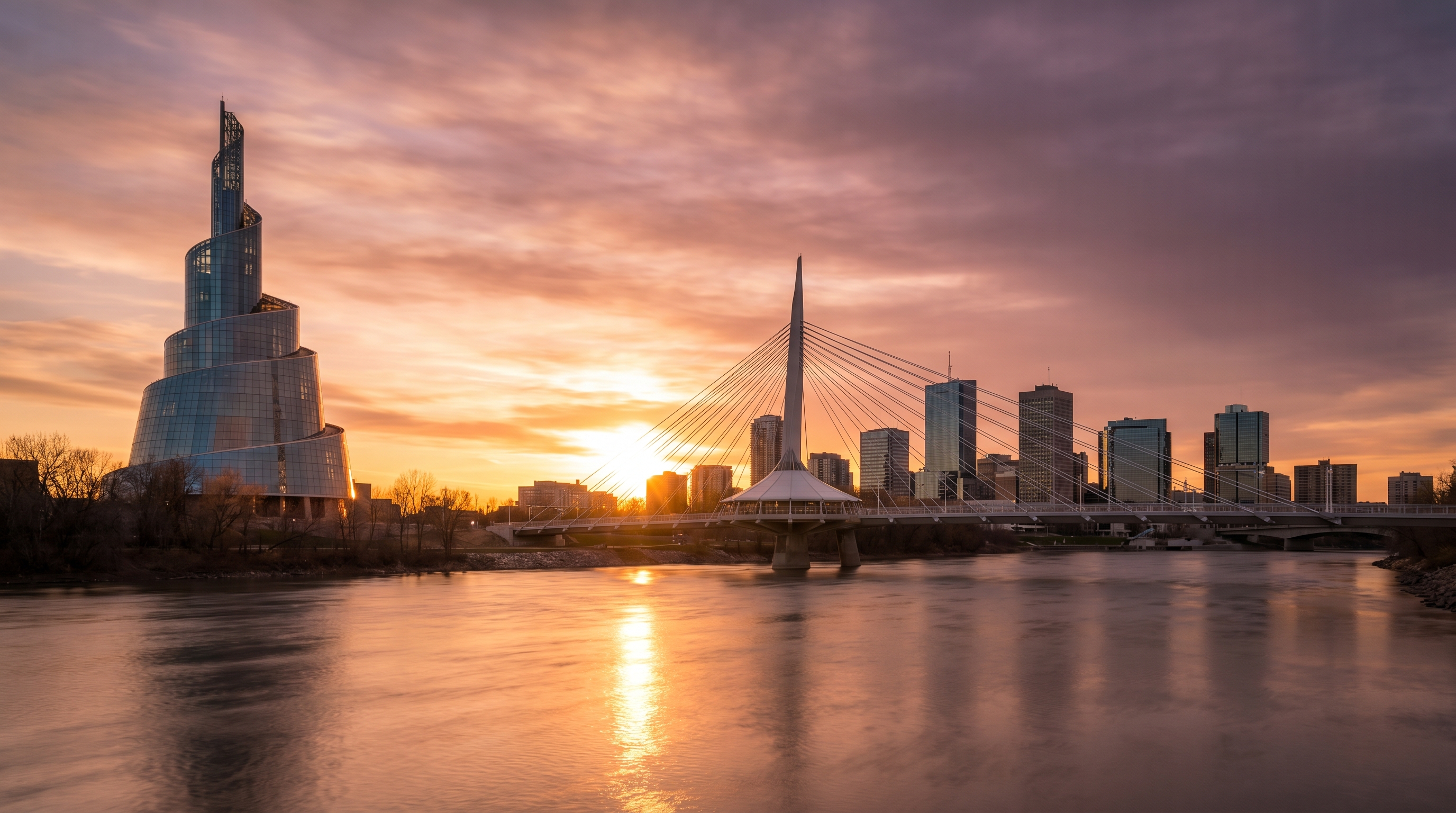 Winnipeg at The Forks with the Canadian Museum for Human Rights and Esplanade Riel bridge at golden hour